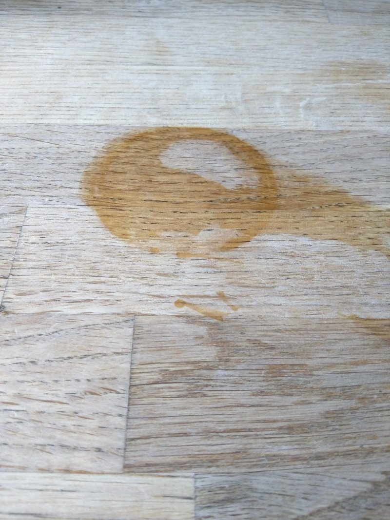 Unfinished restaurant tabletop with water